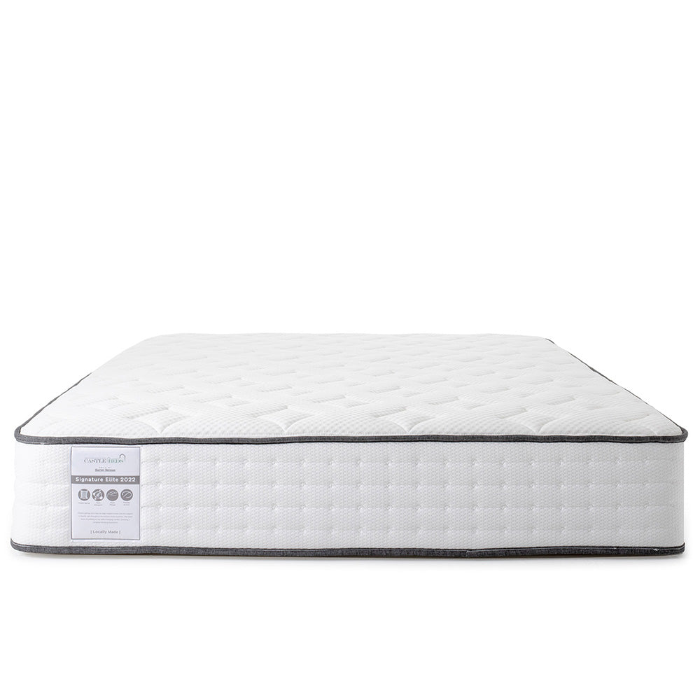White mattress with a label on a white background